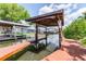 Boat dock featuring a covered lift, offering convenience for boating enthusiasts, along the waterfront at 539 Treviso Dr, Apollo Beach, FL 33572