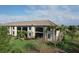 A beautiful aerial view of the property showing lush green lawn, landscaping, and architectural details at 5720 Palmer Cir # 102, Bradenton, FL 34211