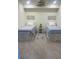 Bedroom showcasing two twin beds, matching comforters, and tiled flooring at 5720 Palmer Cir # 102, Bradenton, FL 34211