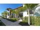 Beautiful townhome exterior showing landscaped grounds with brick paver walkway and private patios for each unit at 5720 Palmer Cir # 102, Bradenton, FL 34211