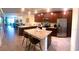 Spacious kitchen featuring stainless steel appliances, a granite island, and ample cabinet space at 5720 Palmer Cir # 102, Bradenton, FL 34211