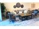 Bright living room featuring a comfortable sofa, a decorative rug, and ample seating space at 5720 Palmer Cir # 102, Bradenton, FL 34211