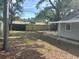 View of the fully fenced backyard with plenty of space for activities and privacy at 6427 2Nd S Ave, St Petersburg, FL 33707