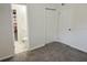 Bedroom showcasing the entry to the bathroom, storage closets, and neutral color scheme at 6427 2Nd S Ave, St Petersburg, FL 33707
