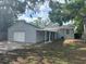 Exterior view of the home with the garage and covered breezeway connecting the buildings at 6427 2Nd S Ave, St Petersburg, FL 33707