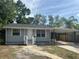 Charming one-story home featuring a covered carport and well-maintained landscaping at 6427 2Nd S Ave, St Petersburg, FL 33707