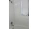 Shower featuring white tile and shower head fixture at 6427 2Nd S Ave, St Petersburg, FL 33707