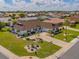 Aerial view showcasing the home's prime location and meticulously landscaped surroundings at 702 Plumbrook Rd, Sun City Center, FL 33573
