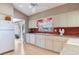 Well-lit kitchen with lots of cabinet space and modern appliances at 702 Plumbrook Rd, Sun City Center, FL 33573
