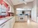 Open concept kitchen with modern appliances and lots of natural light at 702 Plumbrook Rd, Sun City Center, FL 33573
