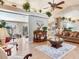 Bright living room with ample seating, hardwood floors, and modern decor at 702 Plumbrook Rd, Sun City Center, FL 33573