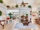 Open-concept living room featuring vaulted ceilings and decorative accents at 702 Plumbrook Rd, Sun City Center, FL 33573