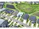 Strategic aerial view highlights the house location with access to a pond in a residential community at 7201 Talamore Dr, Wesley Chapel, FL 33545