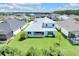 Aerial view of the manicured backyard, showcasing the large lot and screened-in lanai at 7201 Talamore Dr, Wesley Chapel, FL 33545