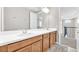 Bathroom featuring a double vanity, framed mirror, and modern fixtures at 7201 Talamore Dr, Wesley Chapel, FL 33545