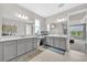 Bright bathroom with double sinks, vanity area, tile floors, and neutral color palette at 7201 Talamore Dr, Wesley Chapel, FL 33545