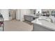 Luxurious bathroom featuring double vanity, neutral colors and a glass shower door at 7201 Talamore Dr, Wesley Chapel, FL 33545