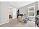Bright bedroom with desk, carpet, and connected bathroom at 7201 Talamore Dr, Wesley Chapel, FL 33545