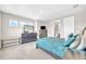 Bedroom with an accent wall, a carpeted floor, and natural light offers comfort at 7201 Talamore Dr, Wesley Chapel, FL 33545
