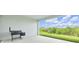 Relaxing covered patio overlooking a lush green yard with a summer kitchen for outdoor cooking at 7201 Talamore Dr, Wesley Chapel, FL 33545