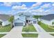 Charming two-story home with a well-manicured lawn and a two-car garage at 7201 Talamore Dr, Wesley Chapel, FL 33545