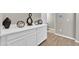 Tastefully decorated hallway with hardwood floors and a built-in display cabinet at 7201 Talamore Dr, Wesley Chapel, FL 33545