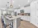 Well-lit kitchen boasting a large center island, stainless steel appliances, and modern pendant lighting at 7201 Talamore Dr, Wesley Chapel, FL 33545