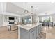 Open kitchen overlooking the living area, complete with an island and pendant lighting at 7201 Talamore Dr, Wesley Chapel, FL 33545