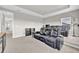 Home theater features tiered seating, plush leather recliners, and a neutral color palette at 7201 Talamore Dr, Wesley Chapel, FL 33545