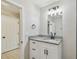 Modern bathroom with vanity, granite countertops, and updated fixtures at 7308 Avonwood St, Tampa, FL 33625