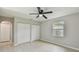 Spacious bedroom with ample closet space, light-colored walls, and large windows at 7308 Avonwood St, Tampa, FL 33625