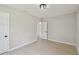 Clean, empty bedroom with natural light and light-colored walls and flooring at 7308 Avonwood St, Tampa, FL 33625