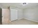 Spacious bedroom with large closet, neutral paint, and modern flooring at 7308 Avonwood St, Tampa, FL 33625