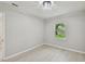 Bedroom featuring modern flooring, fresh paint and natural light from a window at 7308 Avonwood St, Tampa, FL 33625