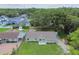 Inviting single-story home featuring a well-maintained lawn and green exterior at 7308 Avonwood St, Tampa, FL 33625