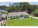 Aerial view of single-story home showing well-maintained lawn and established landscaping at 7308 Avonwood St, Tampa, FL 33625