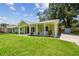 Charming single-story home with a welcoming front porch and well-kept lawn at 7308 Avonwood St, Tampa, FL 33625