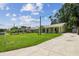 Well-maintained single-story home with a long driveway and inviting front porch at 7308 Avonwood St, Tampa, FL 33625