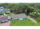 Quaint single-story home with a large yard, a driveway, and a welcoming front porch at 7308 Avonwood St, Tampa, FL 33625