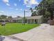 Charming single-story home with a well-manicured front lawn and inviting curb appeal at 7308 Avonwood St, Tampa, FL 33625