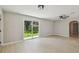 Living room features sliding glass doors that offers seamless indoor-outdoor living at 7308 Avonwood St, Tampa, FL 33625