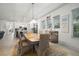 Dining area has a decorative chandelier, stylish furnishings and access to kitchen and living area at 7520 Paradiso Dr, Apollo Beach, FL 33572