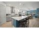 Spacious kitchen featuring a large island, stainless steel appliances, and sleek modern design at 7520 Paradiso Dr, Apollo Beach, FL 33572