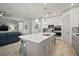 Beautiful kitchen features a marble island, stainless steel appliances, and modern finishes for a sleek design at 7520 Paradiso Dr, Apollo Beach, FL 33572