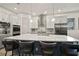 Kitchen with a large island, stainless steel appliances, gray and white cabinets, and modern pendant lighting at 7520 Paradiso Dr, Apollo Beach, FL 33572