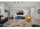Elegant living room showcases a stone accent wall, stylish furnishings, and recessed lighting at 7520 Paradiso Dr, Apollo Beach, FL 33572