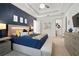 Spacious bedroom with modern furnishings, a tray ceiling, and a king-size bed with decorative pillows at 7520 Paradiso Dr, Apollo Beach, FL 33572