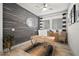 Stylish office with a wood accent wall, modern desk, and neutral decor at 7520 Paradiso Dr, Apollo Beach, FL 33572