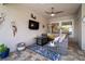 Relaxing outdoor living area with comfortable seating, a ceiling fan, and stylish decor that is perfect for entertaining at 7520 Paradiso Dr, Apollo Beach, FL 33572