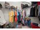 Organized walk-in closet with ample hanging space, shelving, and storage solutions for clothing and accessories at 7520 Paradiso Dr, Apollo Beach, FL 33572